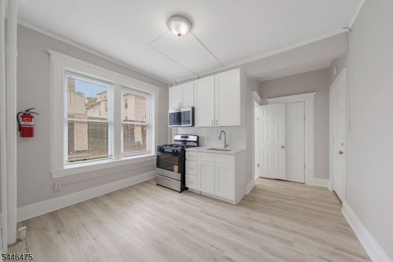 Kitchen Kitchen with stainless appliances, cabinetry, and window.