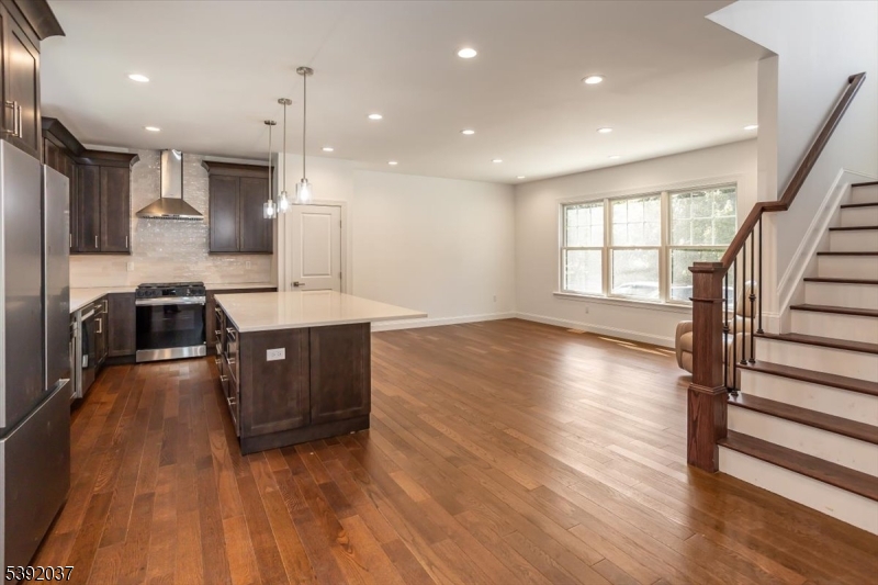 Kitchen View of Living Room High End Finishes and Hardwood Floors Throughout