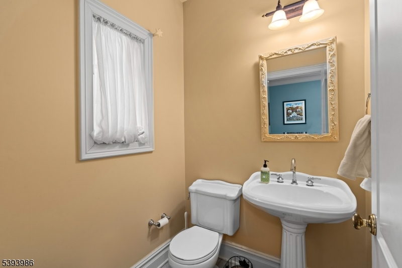 Informal Powder Room Accessible from Mud Room