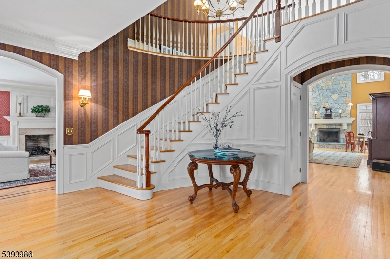 Entrance Foyer Sweeping Staircase w/ Custom Woodwork