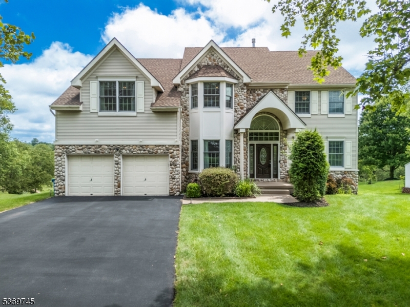 2 Car Garage and Blacktop Driveway