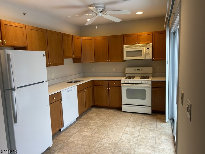 Brand new countertops, slider provides natural light to pour in and also gives accesses to the patio.