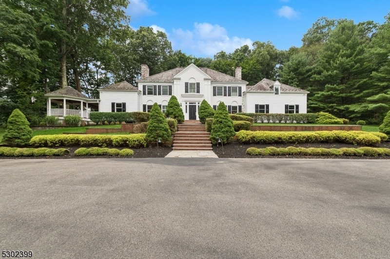 Beautiful brick and clapboard Georgian style Colonial w Vermont slate roof. Beautiful landscaped 5.5 acres w plenty of parking.