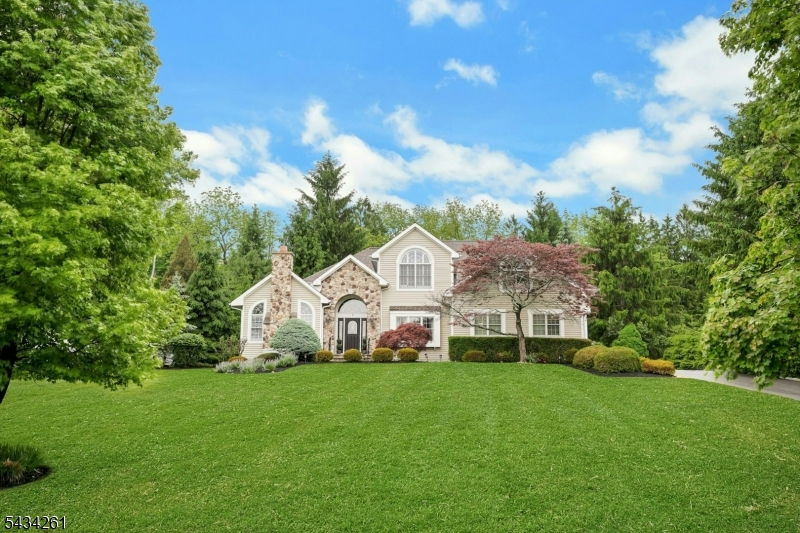 VIEW FROM STREET Situated on low-traffic cul de sac street, this partial stone front home with professionally landscaped grounds and front yard sprinkler system offers spectacular curb appeal!