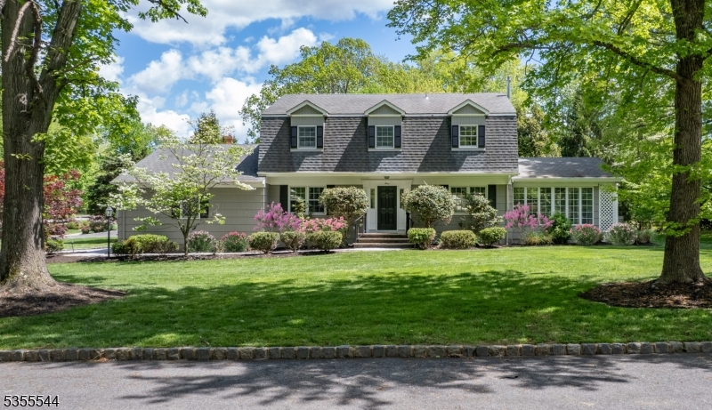 Nestled on a quiet corner, this 4 BR center hall colonial has a gorgeous setting and perfect backdrop for relaxing and entertaining.