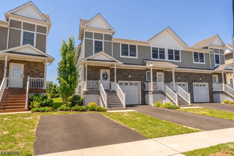 Beautiful curb appeal with private driveway and garage