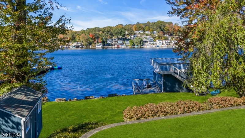 Yard with 2 level open areas Upper level off patio and a lower lakefront level yard perfect for lakeside entertainment!