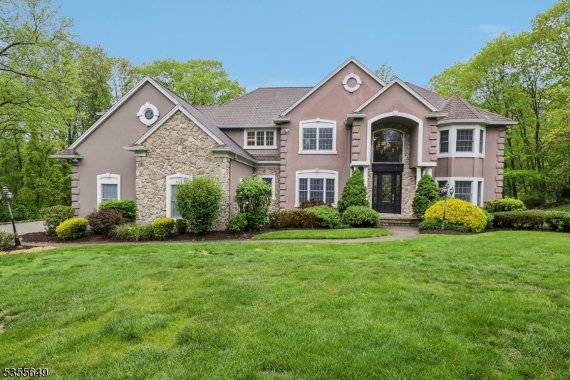 Welcome to this  exquisite Custom Colonial located in the highly sought-after Sawmill Estates neighborhood.