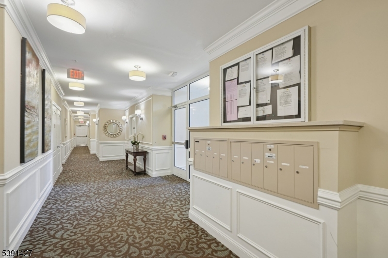 . Building entry to this ground floor unit. Access to your private garage right down the hall.