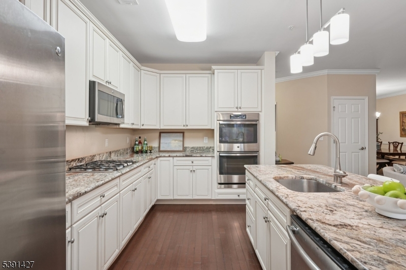 . Lovely quartz countertops. Upgraded appliance and finishes from the start.