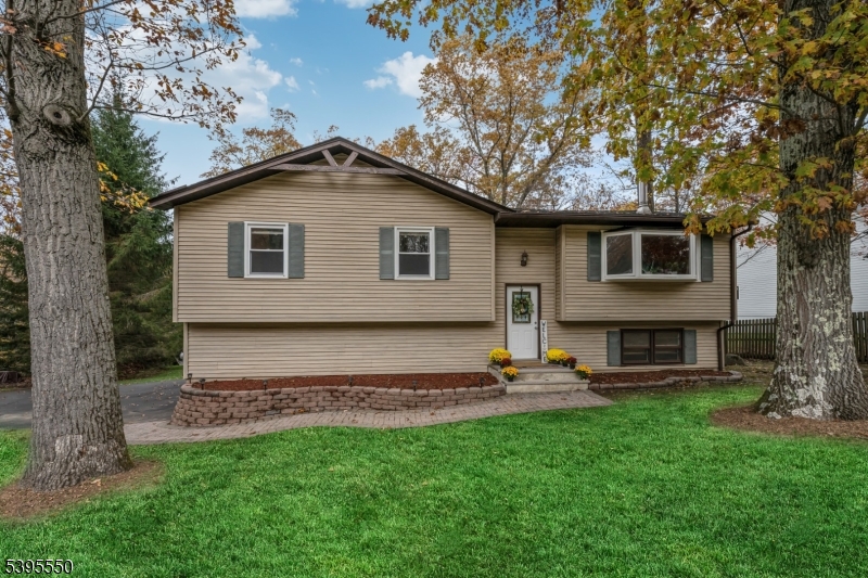 Front This home welcomes you with beautiful natural surroundings and a peaceful, tree-lined setting. A private driveway winds through mature landscaping and lush greenery, offering an immediate sense of calm and privacy from the moment you arrive.