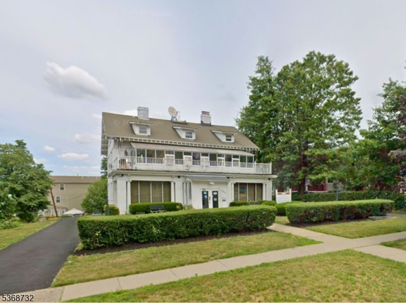 Attractive facade with neat landscaping and a welcoming entryway. Large windows brighten the interior, while a sturdy front door invites guests inside. Classic design meets modern care, creating a great first impression from the street.
