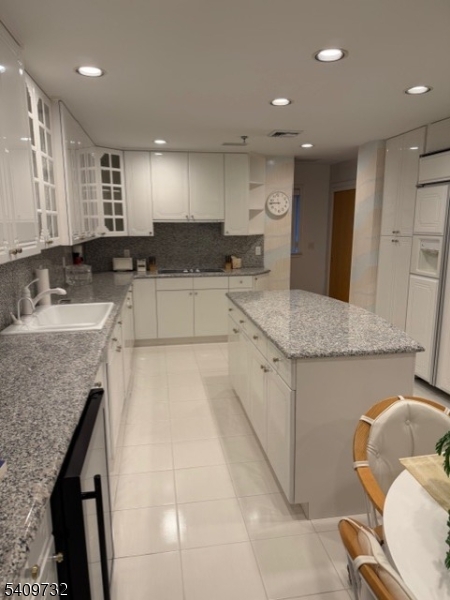 CUSTOM CABINETS WITH ISLAND AND GRANITE.