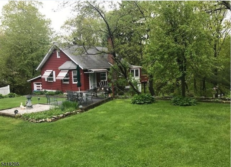 Front of the homes detailing the lush green lawn!