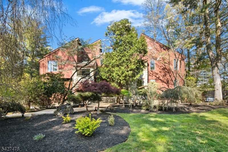 a private oasis set on a manicured acre lot!