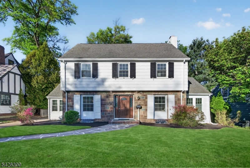Exceptional Center Hall Colonial nestled in the highly sought-after Knollwood section of Short Hills
