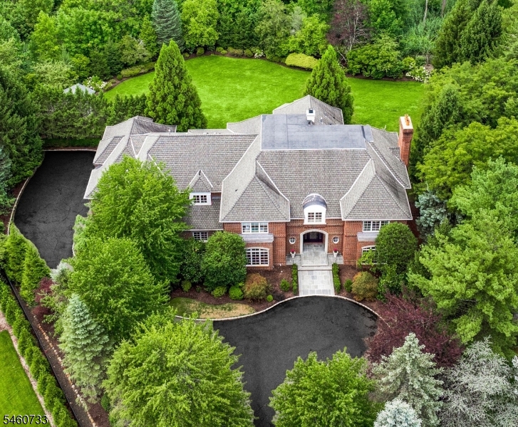 An aerial view shows the scale of the estate: 0.84 acres on a private cul-de-sac, with a level rear lawn and room for an approved pool and pool house.