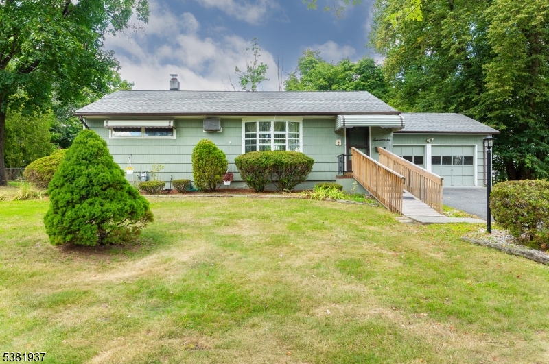 Charming curb appeal welcomes you home! This well-kept ranch offers a spacious yard, mature landscaping & inviting front entry. Enjoy easy access with ramp, garage parking & a property full of potential in a desirable neighborhood!