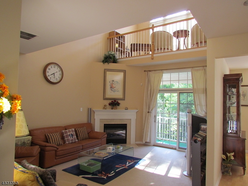 Double story with gas fire place,sliding doors to balcony.