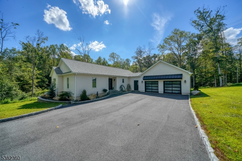 Stunning raised ranch, built in 2022, with custom features throughout!