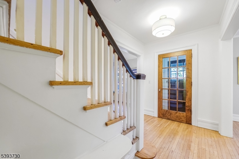 Center Entry Hall to Vestibule Refinished floors + newly painted