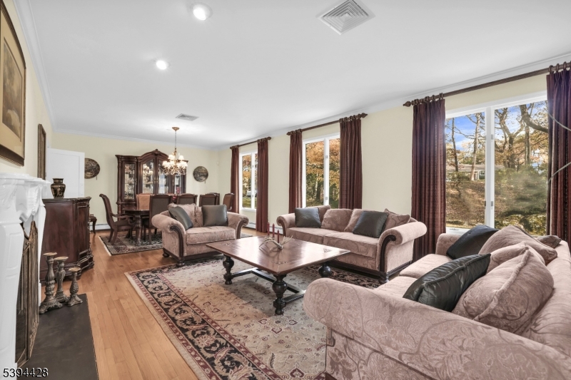 Formal Living Room Wood floors, crown molding, recessed lighting.