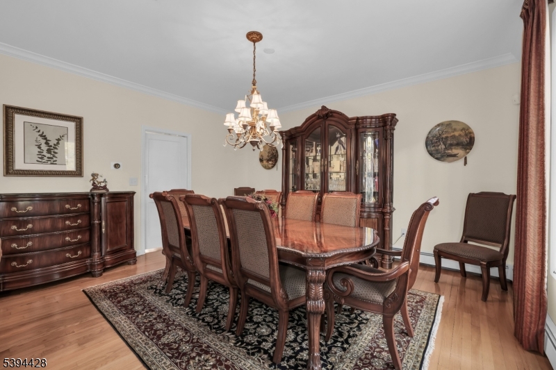 Formal Dining Room Wood floors, crown molding.