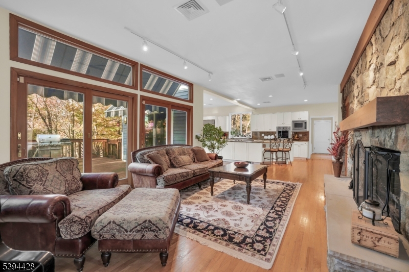 Family Room Two sliders to deck. Transom windows.