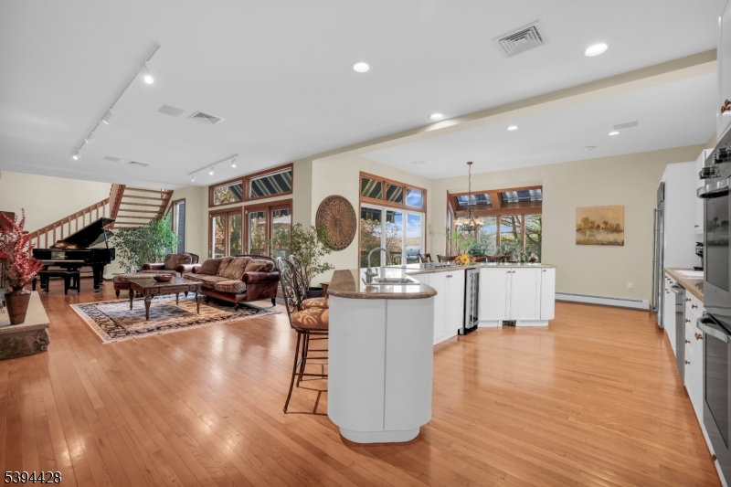 Eat-In Kitchen Wood floors, recessed lighting. Open to family room.