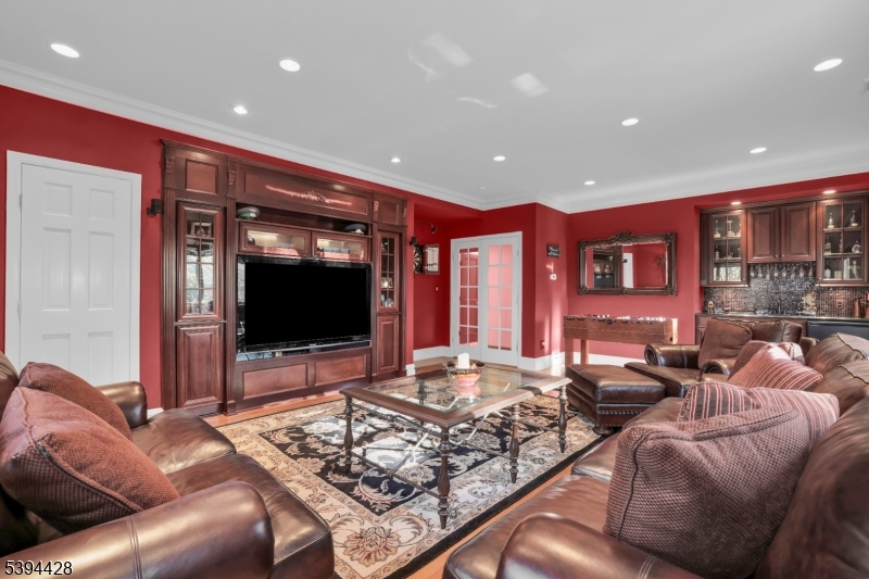 1st Floor Leisure Room Walk-in closet, built-in entertainment center with TV, wet-bar.