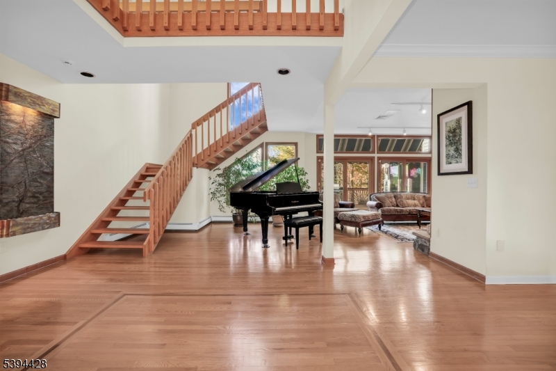 Spacious Entry Foyer Wood floors with decorative inlay.
