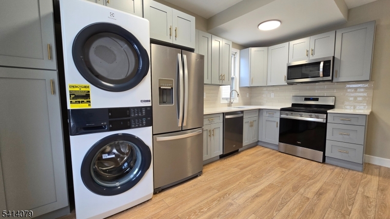 Kitchen and Laundry Dishwasher and new appliances, cabinets