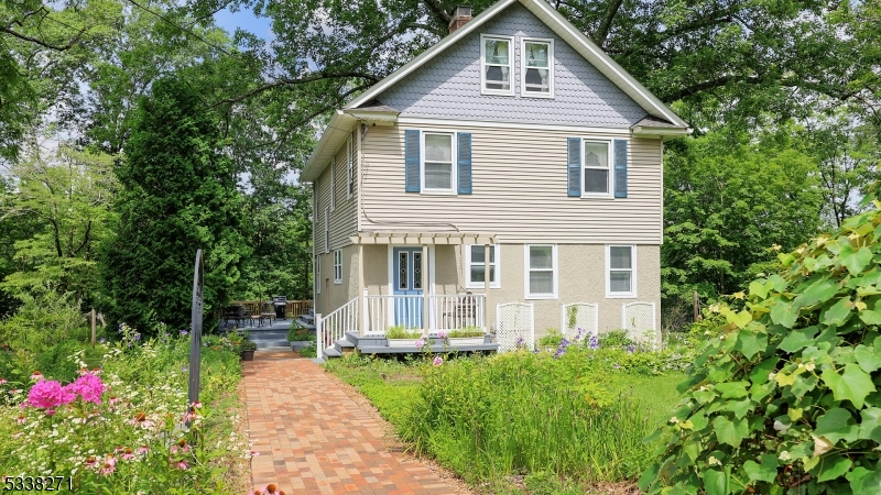 Beautiful perennial gardens surround the home.