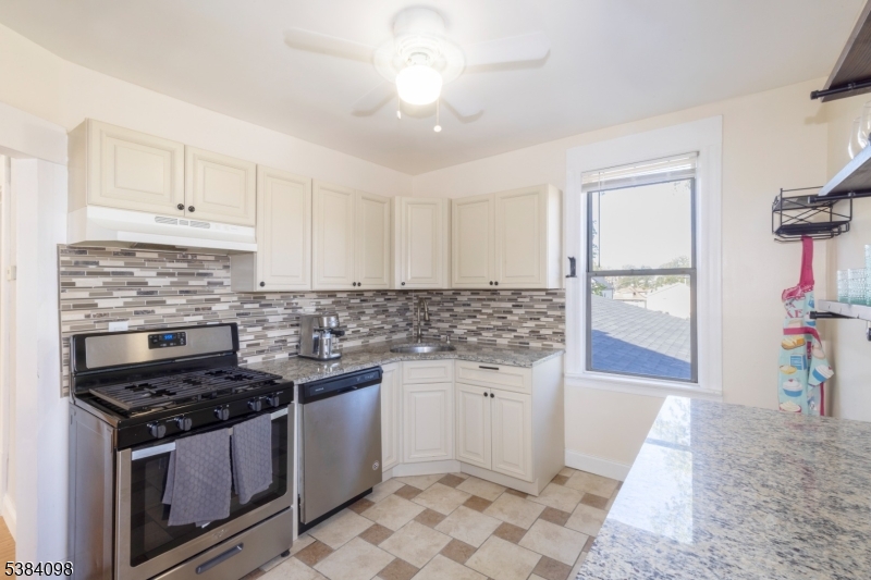 Kitchen w/ stove & dishwasher