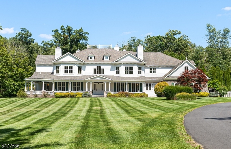 Custom Colonial on a private road, beautifully set on a 16.52-acre gated property, with 11+ acres fully fenced.