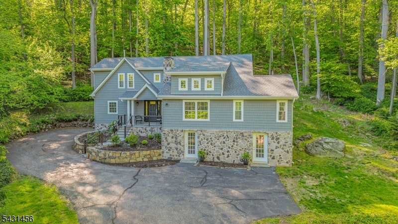 Exterior Front of Home Situated on a peaceful private wooded lot