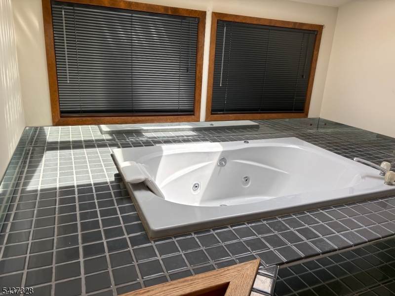 Private Jacuzzi style tub Who needs the spa when you have your very own jacuzzi style tub in you Primary suite