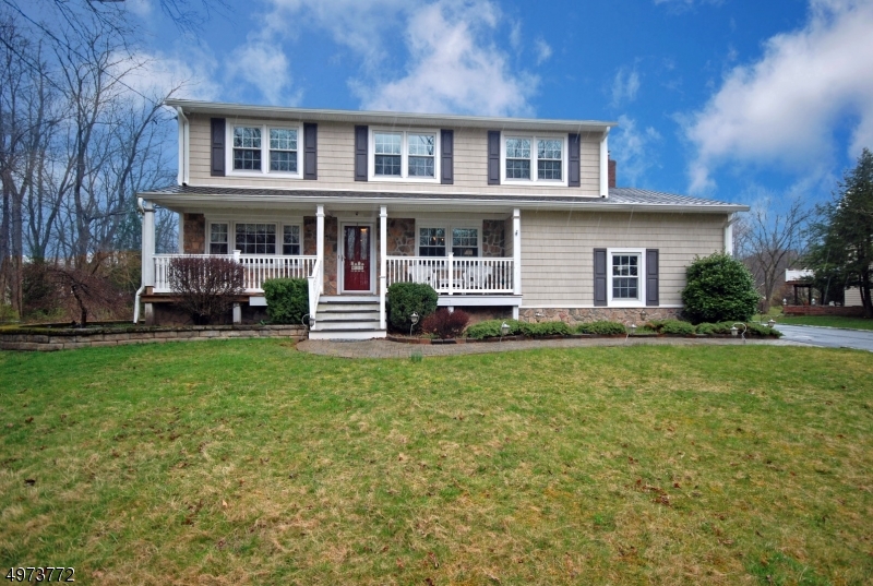 Set attractively back from the curb lies our classic, 2-story home situated on a lush and level one acre parcel within a quiet, residential collection.