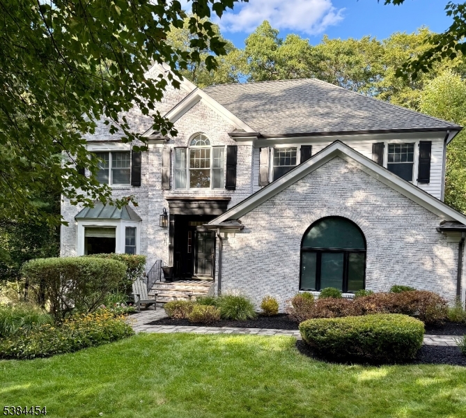 Beautiful yard and gardens welcome you to the 5 bedroom home on this charming and quiet cut-de-sac