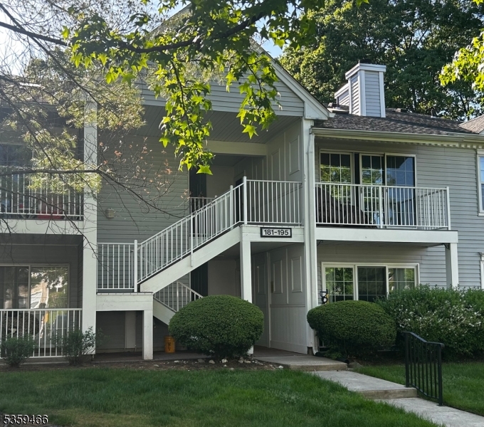 Front of building, entrance is on the left in the first floor entrance hallway.
