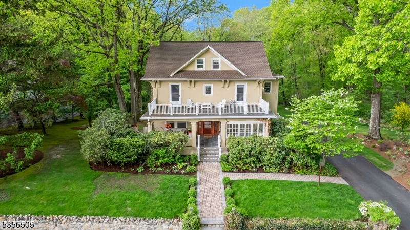 Set on .84 acres with beautiful gardens.