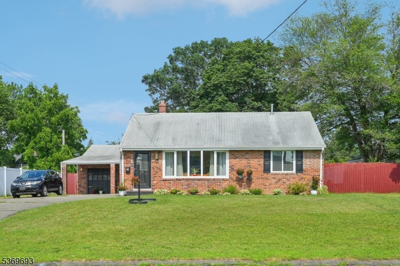 Welcome home to this well maintained Expanded Ranch nestled on a beautifully landscaped lot.