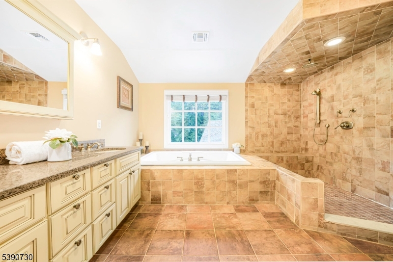 Primary En Suite Spacious, Loads of Closets, Gas Burning Fireplace and Balcony overlooking backyard, and more.