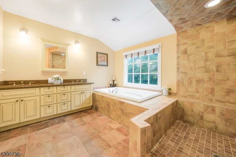 Primary En Suite Spacious, Loads of Closets, Gas Burning Fireplace and Balcony overlooking backyard, and more.