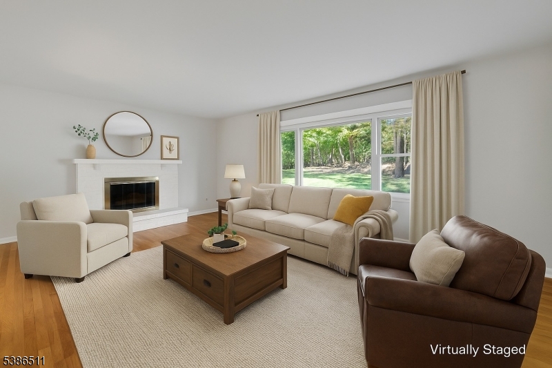 Family Room - Virtually Staged Family Room with wood burning Fireplace overlooking private backyard!