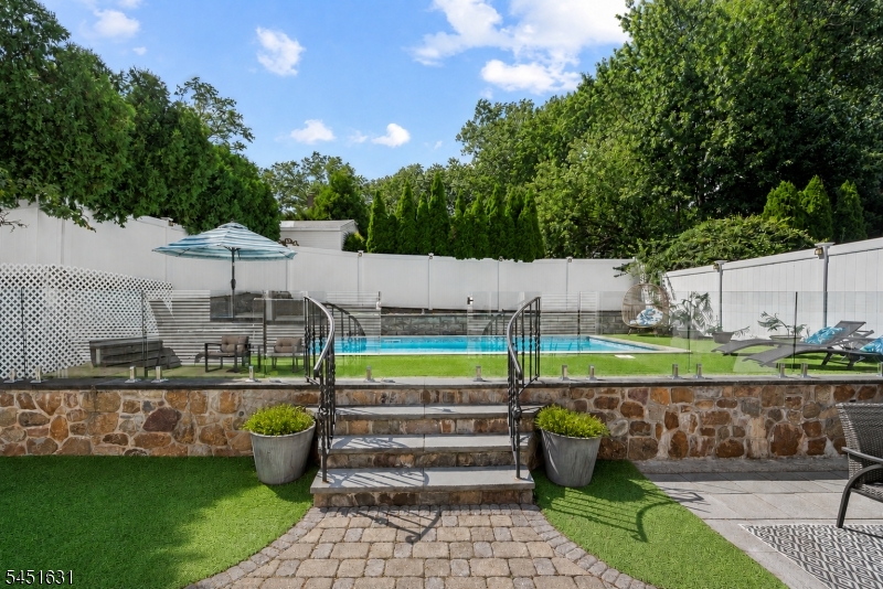 Gorgeous landscaped backyard with inground heated salt water pool!