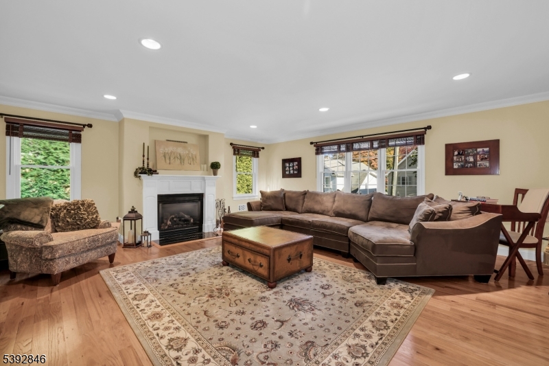 Family Room w/Gas Fireplace Crown molding, recessed lighting, wood floors