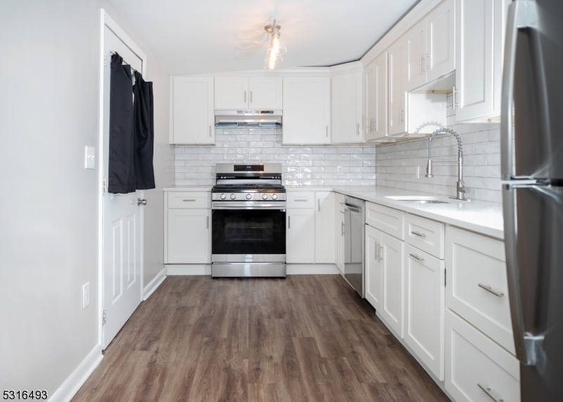 NEW APPLIANCES / AND CABINETRY!  ACCESS DOOR TO THE YARD