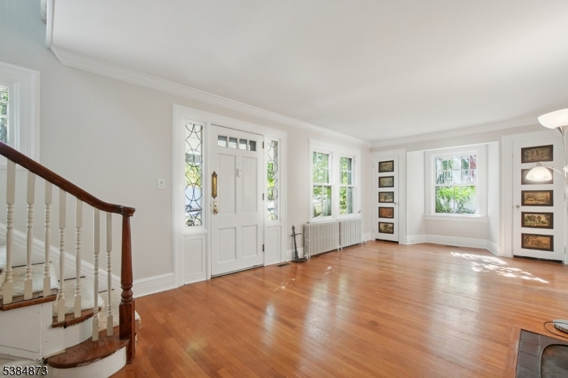Living Room hardwood floors, two guest coat closets