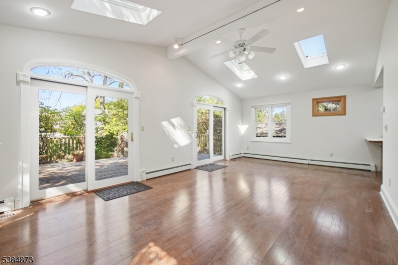 Great Room/Family Room Two double sliders to spacious deck. Light & Bright